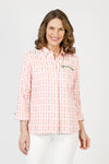 Cali Girls Betty Check Embroidered Blouse in Coral/white.  Gingham check with contrast color embroidery.  Pointed collar button down blouse with hidden button placket.  3/4 sleeve with fold back cuff and button detail.  Green zipper detail above left breast.  Back yoke with ring tab and inverted back pleat.  Relaxed fit._t_59841889370478