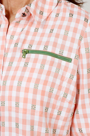 Cali Girls Betty Check Embroidered Blouse in Coral/white.  Gingham check with contrast color embroidery.  Pointed collar button down blouse with hidden button placket.  3/4 sleeve with fold back cuff and button detail.  Green zipper detail above left breast.  Back yoke with ring tab and inverted back pleat.  Relaxed fit._59841889665390