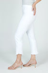 Holland Ave Denim Angle Fringe Crop in White.  Pull on pant with hidden waistband. Faux fly.  2 rear patch pockets.  Angled hem with frayed detail.  Snug through hip and thigh, slim to hem. 25 1/2" inseam at longest point._t_59680323830126