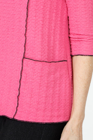 Top Ligne Texture Knit Stitch Pocket Top in Pink.  Crew neck 3/4 sleeve top in lightweight puckered fabric.  Off center front seaming with black top stitching and hidden front pocket.  Plain back.  Black stitch trim at neck, hem and cuff. Relaxed fit._59584339181934