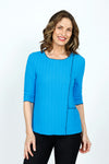 Top Ligne Texture Knit Stitch Pocket Top in Turquoise.  Crew neck 3/4 sleeve top in lightweight puckered fabric.  Off center front seaming with black top stitching and hidden front pocket.  Plain back.  Black stitch trim at neck, hem and cuff. Relaxed fit._t_59584339116398