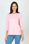 Lolo Luxe Laser Cut Flower Tee in Pink.  Crew neck 3/4 sleeve tee.  Laser cut small flowers scattered on front and sleeves.  Laser cut small circles around neckline. Plain back Relaxed fit._t_59622839583086