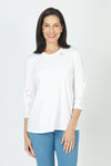 Lolo Luxe Laser Cut Flower Tee in White.  Crew neck 3/4 sleeve tee.  Laser cut small flowers scattered on front and sleeves.  Laser cut small circles around neckline. Plain back Relaxed fit._t_59622839681390