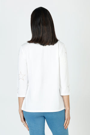 Lolo Luxe Laser Cut Flower Tee in White.  Crew neck 3/4 sleeve tee.  Laser cut small flowers scattered on front and sleeves.  Laser cut small circles around neckline. Plain back Relaxed fit._59622839714158