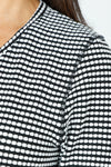 Top Ligne Grid V Neck Shirttail Top in Black/White.  V neck 3/4 sleeve top with shirttail hem.  Raised miniature blocks in white in a grid pattern on black.  A line shape.  Relaxed fit._t_59598244249966