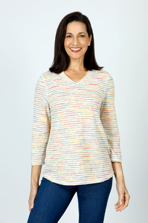 Top Ligne Grid V Neck Shirttail Top in Multi.  V neck 3/4 sleeve top with shirttail hem.  Raised miniature blocks in multi-colors in a grid pattern on white.  A line shape.  Relaxed fit._59598244348270