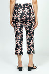 Holland Ave Susan Daisy Fun Crop Pant.  Pink and red daisies on a black background.  No waistband pull on pant with faux zipper placket.  Snug through stomach and thigh, falls straight to hem.  Side leg slits.  Inseam: 24"_t_52987900395886