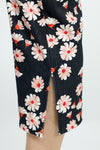 Holland Ave Susan Daisy Fun Crop Pant.  Pink and red daisies on a black background.  No waistband pull on pant with faux zipper placket.  Snug through stomach and thigh, falls straight to hem.  Side leg slits.  Inseam: 24"_t_52987900494190