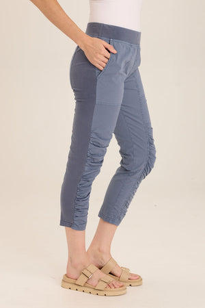 Wearables Geyser Crop in Hypnotic, a medium blue.  Pull on pant with jersey waist.  Poplin body.  Front slash pockets.  Ruched detail down center leg.  Jersey insets on side leg.24 1/2" inseam._59797428535662