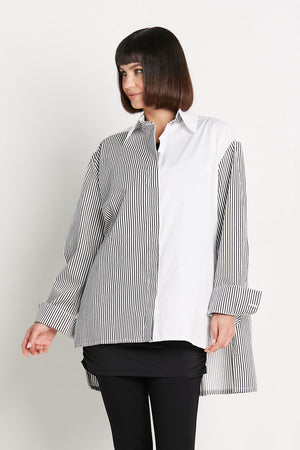 Planet Kool Shirt in White/Stripe.  Half and half button down shirt: 1/2 stripes, 1/2 solid.  Long sleeves with button cuff.  High low hem.  Deep side slits. Solid back yoke. Oversized fit.  One size fits many._35927009001672