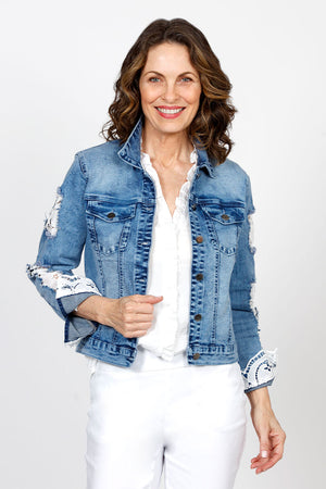 Frederique Lace Back Denim Jacket in Denim.  Jean jacket styling.  Solid denim front, sleeves and back yoke.  Lace back with scallop edge.  Lace trim lines cuff.  Distressed patches on sleeves lined with lace.  Classic fit._35563010719944