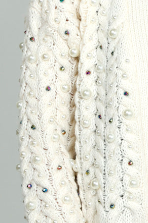 Metric Cardigan with Pearl Detail in Ivory.  Chunky open front cable knit with peal and iridescent stones.  Rib trim at hem and cuff.  Slightly cropped, boxy fit._52919131373934