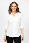 Top Ligne Roll Tab Button Down Top in White. Pointed collar open v neck button down with 3/4 roll button tab sleeves. Curved hem. Lightly textured fabric. Relaxed fit._t_35439032664264