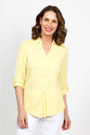 Top Ligne Roll Tab Button Down Top in Yellow. Pointed collar open v neck button down with 3/4 roll button tab sleeves. Curved hem. Lightly textured fabric. Relaxed fit._t_35439032533192