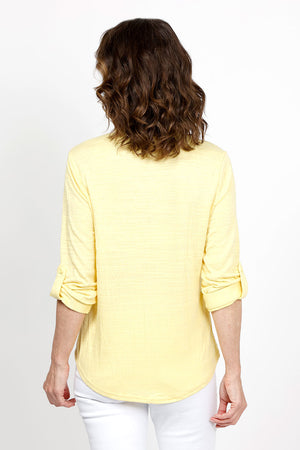 Top Ligne Roll Tab Button Down Top in Yellow. Pointed collar open v neck button down with 3/4 roll button tab sleeves. Curved hem. Lightly textured fabric. Relaxed fit._35439032729800