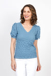Top Ligne Pucker Ruffle Sleeve Top in Steel Blue. V neck puckered top with short gathered sleeve and smocked cuff with ruffle trim.  Relaxed fit._t_35571204456648