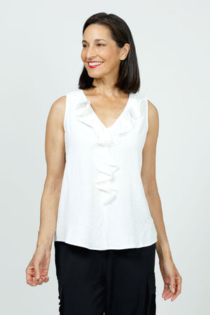 Top Ligne Sleeveless Ruffle Tank in White. V neck sleeveless top with ruffle trim at the neck and half down the front. Curved hem. Relaxed fit._35748038836424