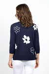 Ten Oh 8 Flower V Neck in Navy with white large flowers. V neck with 3/4 sleeve. Rib trim at hem neck and cuff. Relaxed fit._t_35747681534152
