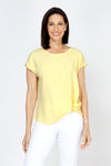 Top Ligne Airflow Twist Hem Top in Banana.  Lightly textured crew neck cap sleeve top with twist hem on left side. Keyhole opening at back neck with button closure.  Relaxed fit._t_59759859335534