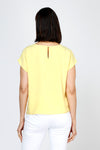 Top Ligne Airflow Twist Hem Top in Banana.  Lightly textured crew neck cap sleeve top with twist hem on left side. Keyhole opening at back neck with button closure.  Relaxed fit._t_59759859302766