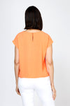 Top Ligne Airflow Twist Hem Top in Cantaloupe.  Lightly textured crew neck cap sleeve top with twist hem on left side. Keyhole opening at back neck with button closure.  Relaxed fit._t_59759859499374