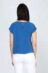 Top Ligne Airflow Twist Hem Top in Indigo.  Lightly textured crew neck cap sleeve top with twist hem on left side. Keyhole opening at back neck with button closure.  Relaxed fit._t_59759859401070