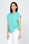 Top Ligne Airflow Twist Hem Top in Turquoise.  Lightly textured crew neck cap sleeve top with twist hem on left side. Keyhole opening at back neck with button closure.  Relaxed fit._t_59759859564910