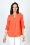 Top Ligne 2 Pocket Button Roll Tab Top in Coral.  Crew neck banded collar with notched v neck.  Button down.  2 breast patch pockets with button flap.  3/4 sleeve with button roll tab.  Gold buttons. Shoulder epaulets.  Shirttail hem.  Relaxed fit._t_59598820049262