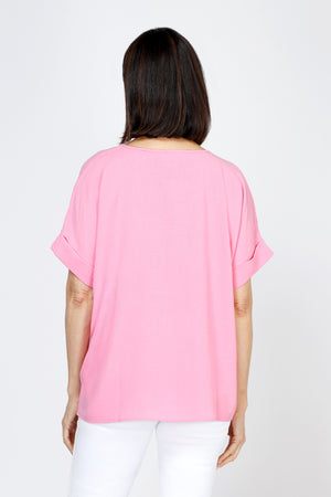 Top Ligne Airflow Dolman V Neck Top in Peony.  Lightly textured and airy top.  V neck with short cuffed dolman sleeves.  A line shape.  Relaxed fit._59764799668590