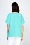 Top Ligne Airflow Dolman V Neck Top in Turquoise.  Lightly textured and airy top.  V neck with short cuffed dolman sleeves.  A line shape.  Relaxed fit._t_59764799832430