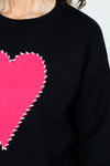 Ten Oh 8 Big Heart Outline Stitch Sweater in Black.  Crew neck drop shoulder long sleeve mid-weight knit.  Large hot pink heart on center front outlined in white blanket stitching.  Rib trim at neck, hem and cuff.  Relaxed fit._t_59519642435950