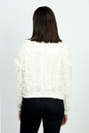 Lolo Luxe Fringe Cardigan in Ivory.  Crew neck open front cardigan with hook and eye closure at neck line.  Open weave with vertical ribbing.  Fringe detail throughout.  Long sleeves.  Rib trim at neck, hem and cuff.  Relaxed fit._t_52987884110190