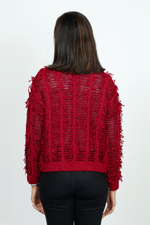 Lolo Luxe Fringe Cardigan in Red.  Crew neck open front cardigan with hook and eye closure at neck line.  Open weave with vertical ribbing.  Fringe detail throughout.  Long sleeves.  Rib trim at neck, hem and cuff.  Relaxed fit._52998207471982