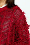 Lolo Luxe Fringe Cardigan in Red.  Crew neck open front cardigan with hook and eye closure at neck line.  Open weave with vertical ribbing.  Fringe detail throughout.  Long sleeves.  Rib trim at neck, hem and cuff.  Relaxed fit._t_52998207504750