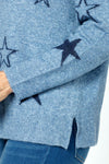 Ten Oh 8 V neck Sweater with Stars in Denim.  Solid and outlines star print on front and sleeves.  Heathered knit.  Long sleeves.  Rib trim at neck, hem and cuff.  Plain back.  Side slits.  Relaxed fit._t_59402397909358