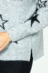 Ten Oh 8 V neck Sweater with Stars in Gray.  Solid and outlines star print on front and sleeves.  Heathered knit.  Long sleeves.  Rib trim at neck, hem and cuff.  Plain back.  Side slits.  Relaxed fit._t_59402397942126