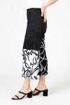 Top Ligne Mixed Scribbles Crinkle Crop in Black/White. Pull on pant with elastic waist.  Right leg in black with white print.  Left leg, 1/2 solid black at top, bottom reversed print white background with black scribble.  Wide leg.  25 1/2" inseam._t_59835023425902