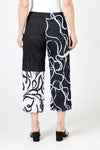 Top Ligne Mixed Scribbles Crinkle Crop in Black/White. Pull on pant with elastic waist.  Right leg in black with white print.  Left leg, 1/2 solid black at top, bottom reversed print white background with black scribble.  Wide leg.  25 1/2" inseam._t_59835023458670