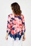 Top Ligne Blurred Flower Tee in Coral.  Coral and white blurred flowers on a navy background.  Scoop neck 3/4 sleeve tee with sewn edges.  Center raised seam.  Inseam solid navy asymmetrical flounce at hem.  Relaxed fit._t_59845647106414