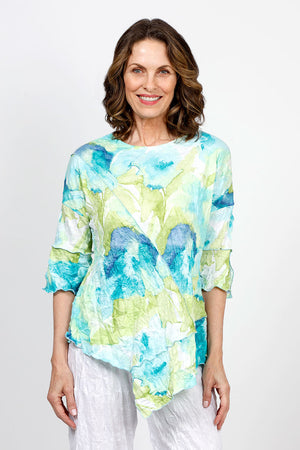 Top Ligne Floral Print Crinkle Tunic in Aqua. Blue aqua and lime  abstract floral print.  Crew neck crinkle with dolman elbow sleeve with ruffle cuff.  Diagonal front seaming with asymmetrical insert at hem.  Sewn edges.  Relaxed fit._35571242205384