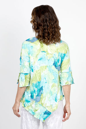 Top Ligne Floral Print Crinkle Tunic in Aqua. Blue aqua and lime abstract floral print. Crew neck crinkle with dolman elbow sleeve with ruffle cuff. Diagonal front seaming with asymmetrical insert at hem. Sewn edges. Relaxed fit._35571242238152