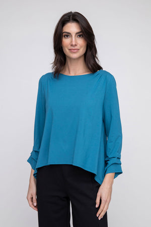 LIV by Habitat Foundation Pleated Top in Ocean.  Crew neck boxy top.  Bracelet sleeve with pleated detail.  Shark-bite inverted curved hem.  Relaxed fit._52923781022062