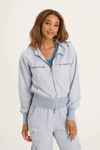 XCVI Karney Bomber in Spry Blue a light blue.  Zip front with attached hood and drawstring.  Long sleeves.  Ribbed banded hem and cuff.  Brushed twill body.  2 chest pockets with zipper closure.  Relaxed fit._t_59588992205166