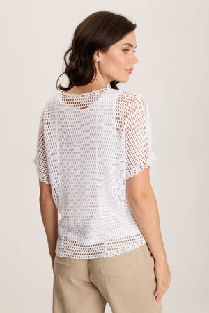 XCV Centre Top in White.  2 piece top with jersey tank and crochet open weave top layer.  Short dolman sleeve.  V neck.  Crochet design at side seams.  Contour seams.  High low hem.  Classic fit._59776865468782