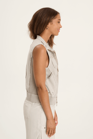 XCVI Grindelle Vest in Whitecap, an off-white.  Convertible collar zip front sleeveless vest.  Distressed Jersey zipper placket.  2 front breast pockets, ribbed insets at banded hem.  Classic fit._59594278338926