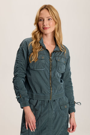 XCVI Burris Jacket in Silken Pine.  Stand collar zip front jacket with elastic hem.  Brass zipper with toggle.  Long sleeve with elastic cuff and cinch toggle down center sleeve.  Cropped length.  Relaxed fit._59776243532142