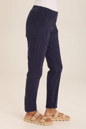 Wearables Dalia Pant in Navy.  Pull on pant with jersey waistband and poplin body.  2 front slash pockets with grommet detail.  Front and back contour seam detail.  Jersey insets at side seams.  30" inseam._59793640161646