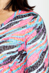 Top Ligne Colorful Stripes V Neck Top in Multi.  Bright zebra-inspired multi colored streaks.  V neck crinkle top with 3/4 sleeve.  Shirttail hem.  Relaxed fit._t_59670286729582