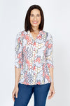 Top Ligne Honeycomb Print Snap Front Top.  Red, black and gold abstract honeycomb print on a white background.  Pointed collar snap front with pairs of snaps down front.  3/4 sleeve with split cuff and laced detail.  Shirttail hem.  Relaxed fit._t_59741436903790