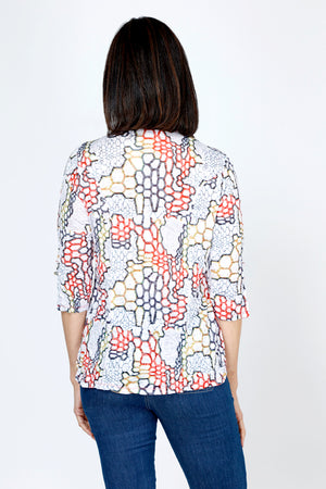 Top Ligne Honeycomb Print Snap Front Top.  Red, black and gold abstract honeycomb print on a white background.  Pointed collar snap front with pairs of snaps down front.  3/4 sleeve with split cuff and laced detail.  Shirttail hem.  Relaxed fit._59741436969326